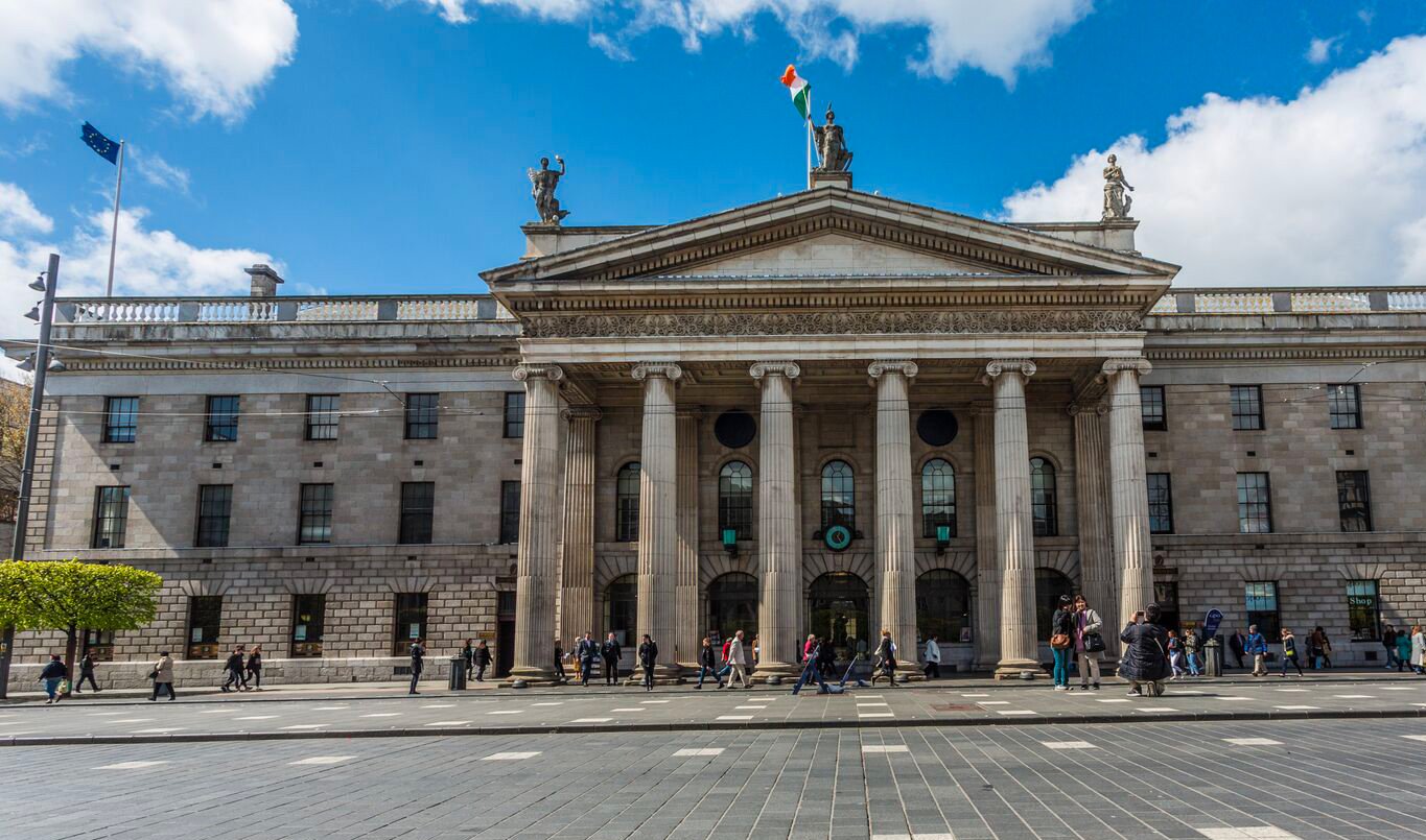 General Post Office Traffic free O'Connell Street with pedestrians outside General Post Office on sunny day with blue sky